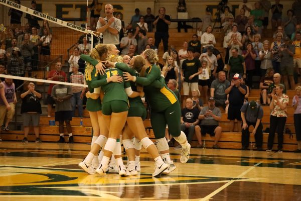 CELEBRATION — The Cats celebrate a long-awaited win after starting the season 2-10, performing a 3-0 sweep against Michigan Tech.
