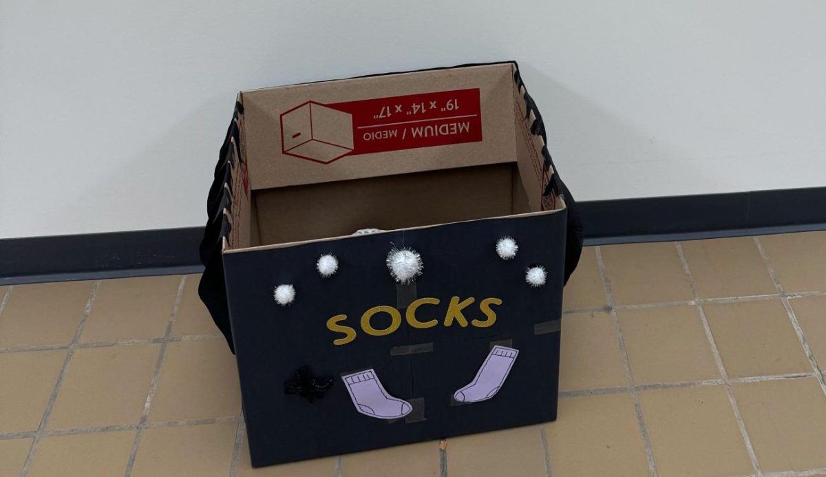 SOCK DRIVE — Socktober donation boxes like these can be found throughout campus, including the Lydia M. Olson Library, The Science Building, Weston Hall, residence hall lobbies and the Northern Center.