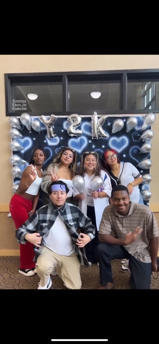 KICKBACK AND RELAX — LSU and BSU members pose with decorations in front of Y2K back drop at the third Annual LSU x BSU Kickback. Photo Courtesy of Jamarie Calhoun, BSU Treasurer