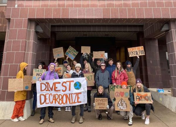 UNIVERSITY DIVESTMENT UPDATE — DivestNMU members protest at Cohodas Hall in April, 2023. 
As of December 2023, the Northern Michigan University Board of Trustees gave full support in divestment. Photo Courtesy of Kolibri Drobish