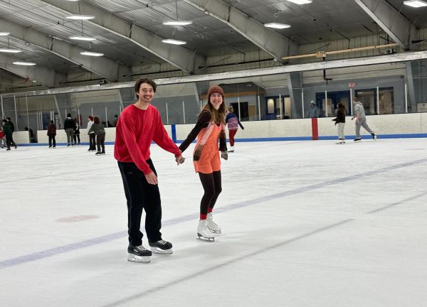 SPINNING WITH THE SNOWFLAKES — Students skate and spin with the snowflakes at a Valentines Day-themed open skate. 