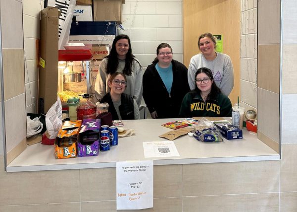 POPCORN SALE — Greek life sets up shop in Jamrich Hall ticketing booth to sell popcorn for a local cause.