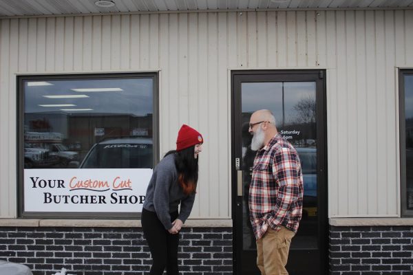 OPENING SOON -  Katelyn Milano (left) and her father (right) outside of their new business, Milano Smokehouse Meats. Located in the old building of Glenns Smokehouse in Ishpeming, the shop is set to open in mid-April.