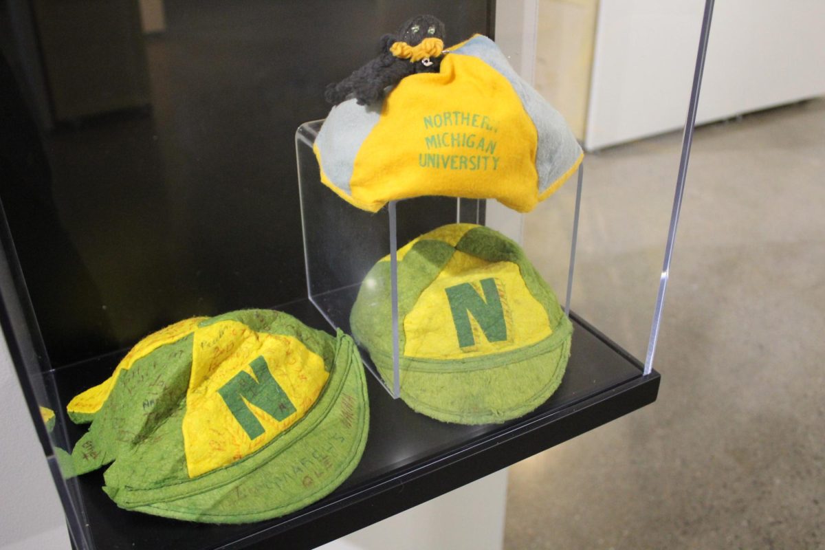 HOMECOMING BEANIES — Sitting immortalized in a glass case in the Beaumier U.P Heritage Center, these beanies held a fun tradition and should be set free and make a return.