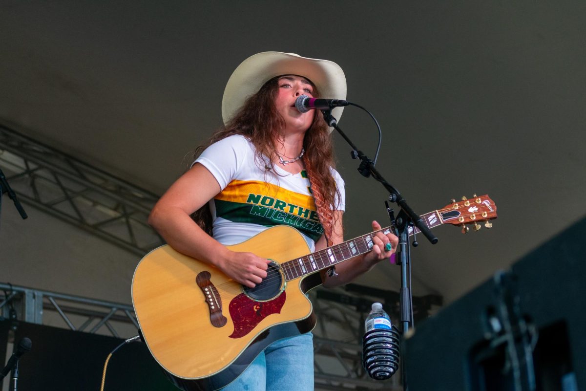 LOUD AND CLEAR — Student Sami Brown opens for Maddie & Tae at NMU's Homecoming Concert.