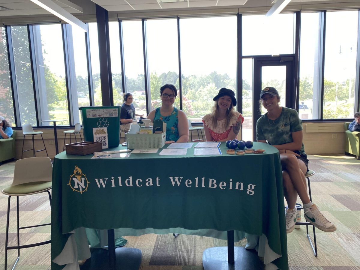 HELPING HANDS - Student volunteers working for the NMU WellBeing Center set up tables throughout Jamrich to pass out pamphlets, fliers, bracelets and stress balls. Students could enter a raffle to win a variety of self-care items.
