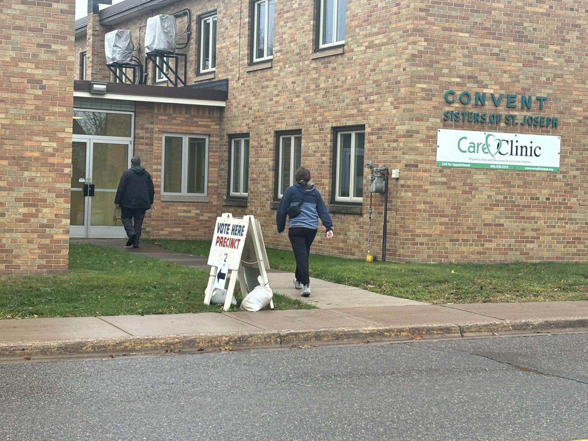 GO OUT AND VOTE — Ishpeming residents head inside the second voting station in their city, on the morning of Nov. 5. Much like I had, peacefully utilizing their rights as Americans. 