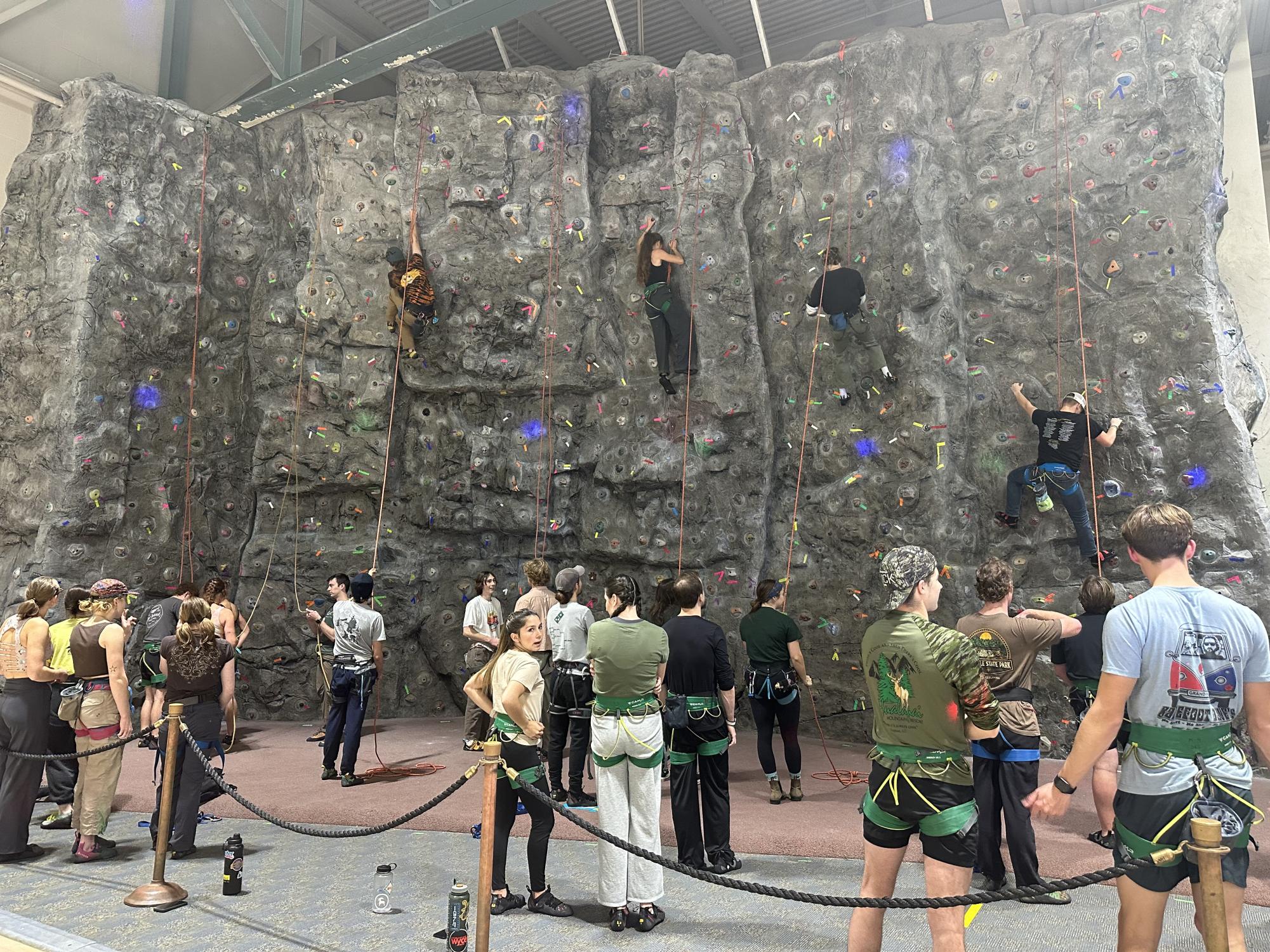 THE CLIMB - Students climb the wall at the PEIF for the ORC's Midnight Madness event. 