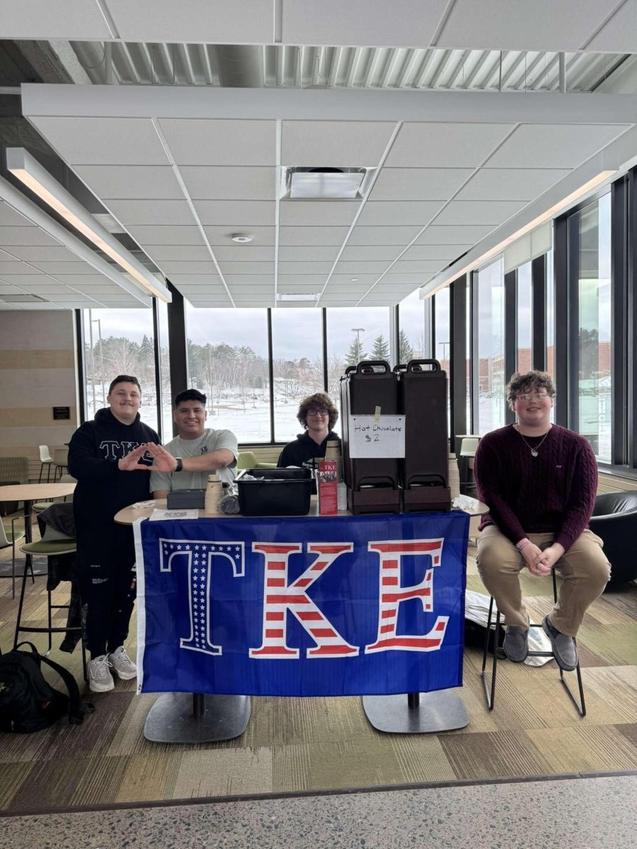 GET YOUR COCOA — TKE sets up shop in Jamrich Hall to sell hot cocoa to the NMU student body, raising travel funds for leadership events they plan to attend. (Photo courtesy of TKE)