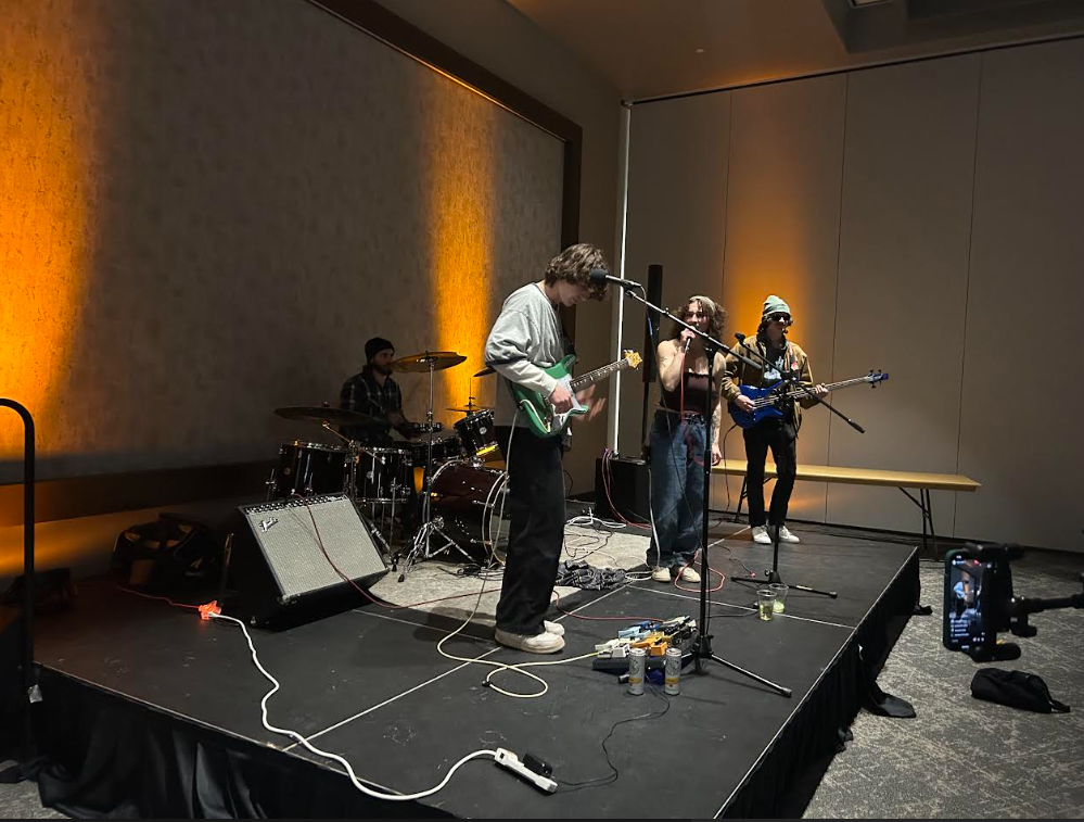 WAY TO ROCK — Student band Total Head rocks the Northern Center during the Peak 25 Conference.