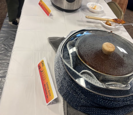 TIME TO JUDGE — Chili chefs get ready for students to judge their recipes at the annual cook-off.