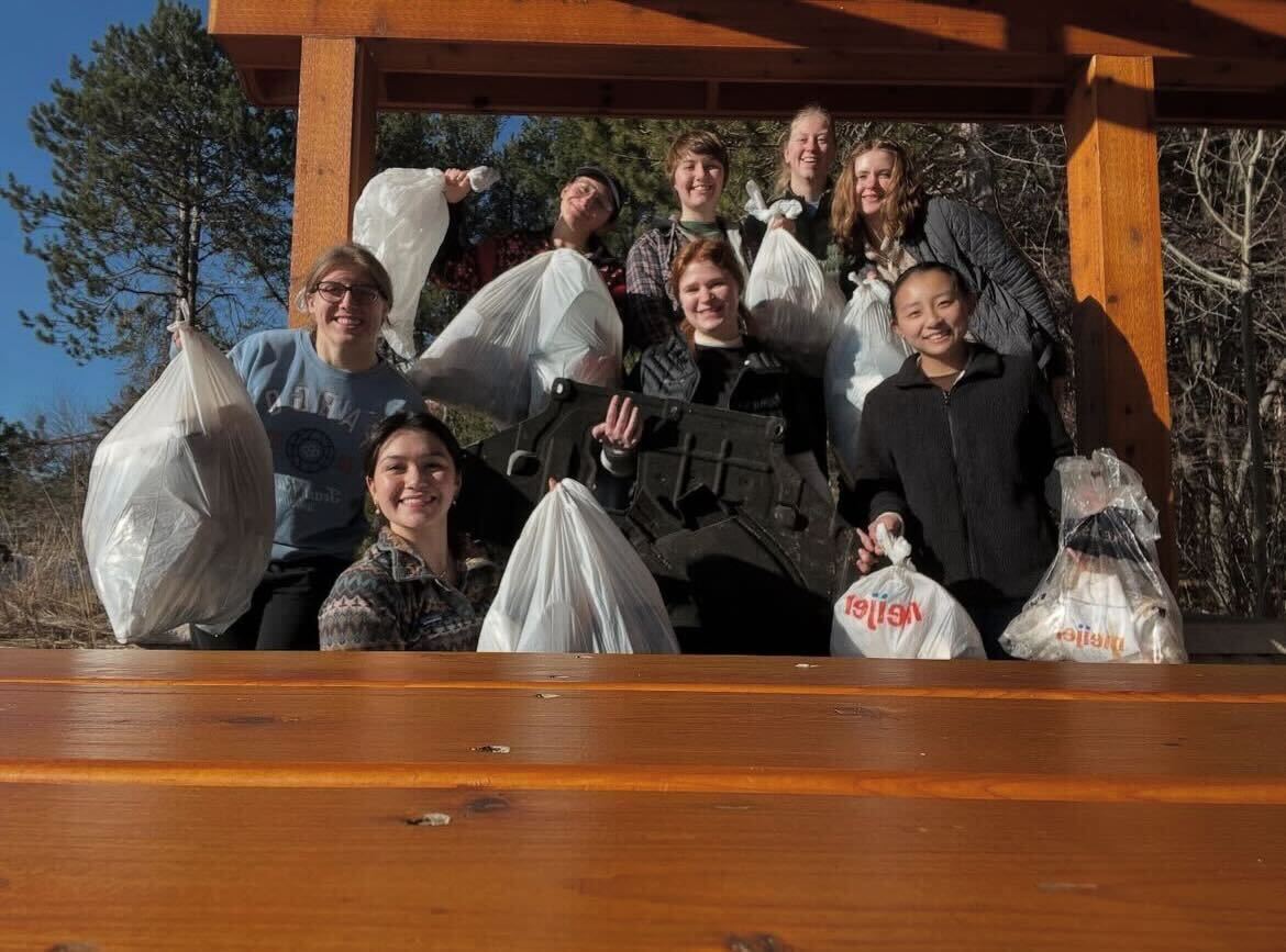 TRASH CLEAN-UP — Students gather together with the Conservation Crew to collect trash around campus. 