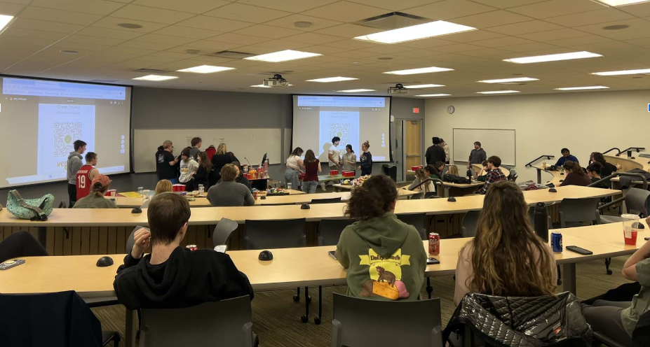 SWOOSH— Students wait for their time to shine at the Greek Council's Pong Tournament for charity.
