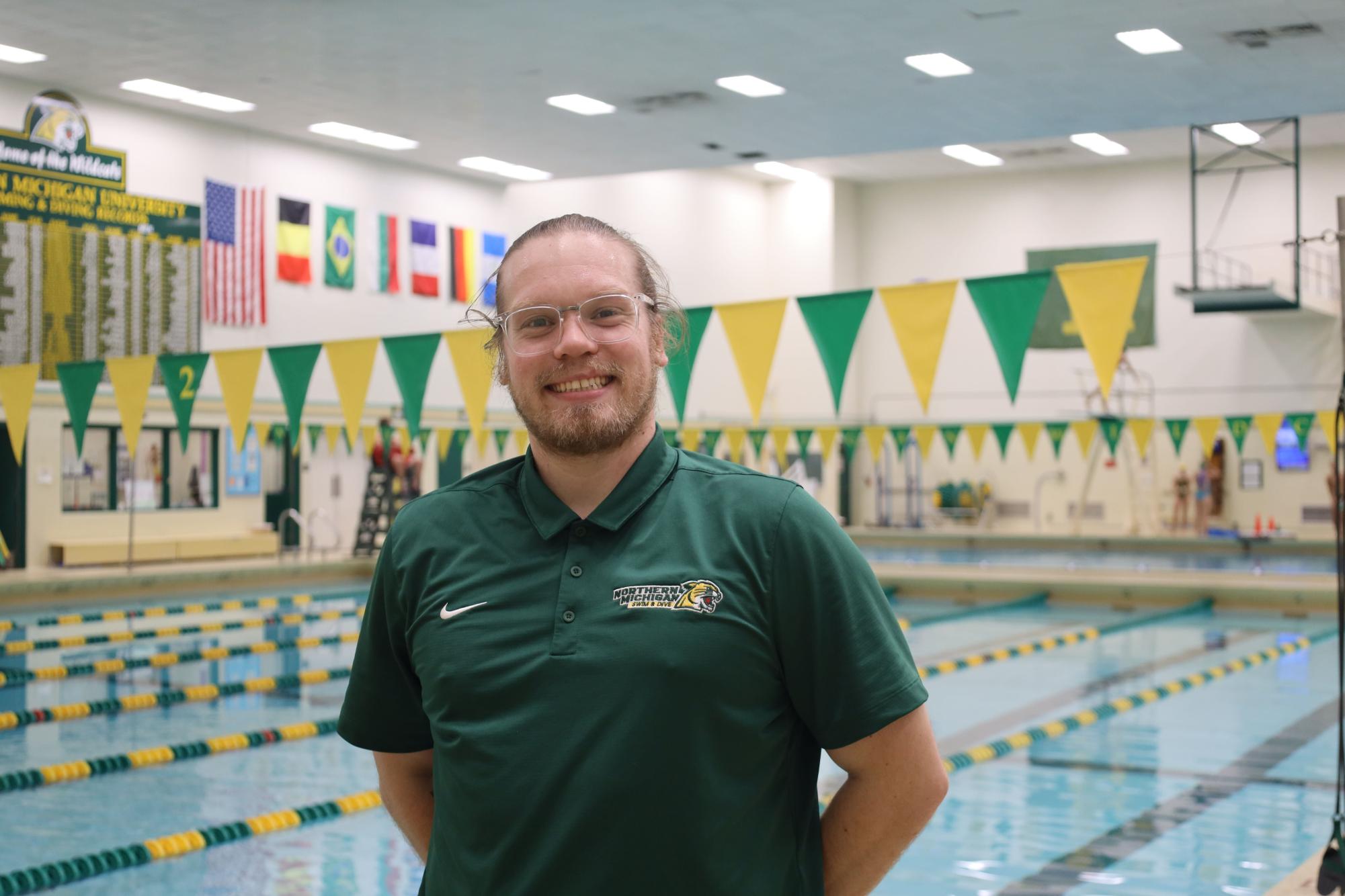 A new wave: coach Lance Bergmann brings a fresh perspective to NMU Swim & Dive