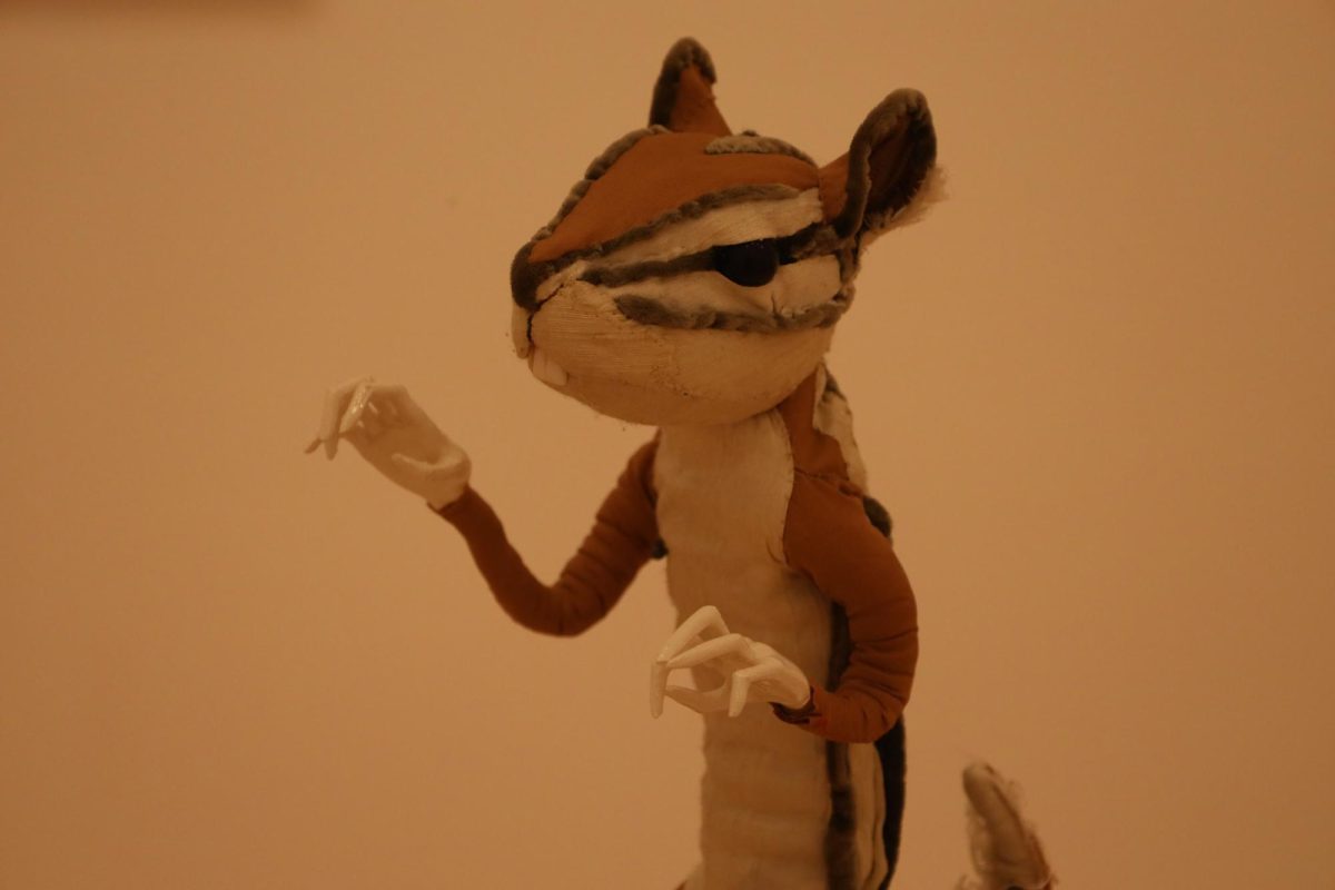 CHIPMUNK (CORRIE STECKELBERG)— Created from silk and linen, this chipmunk statue's details are evocative of the Midwestern critter. 