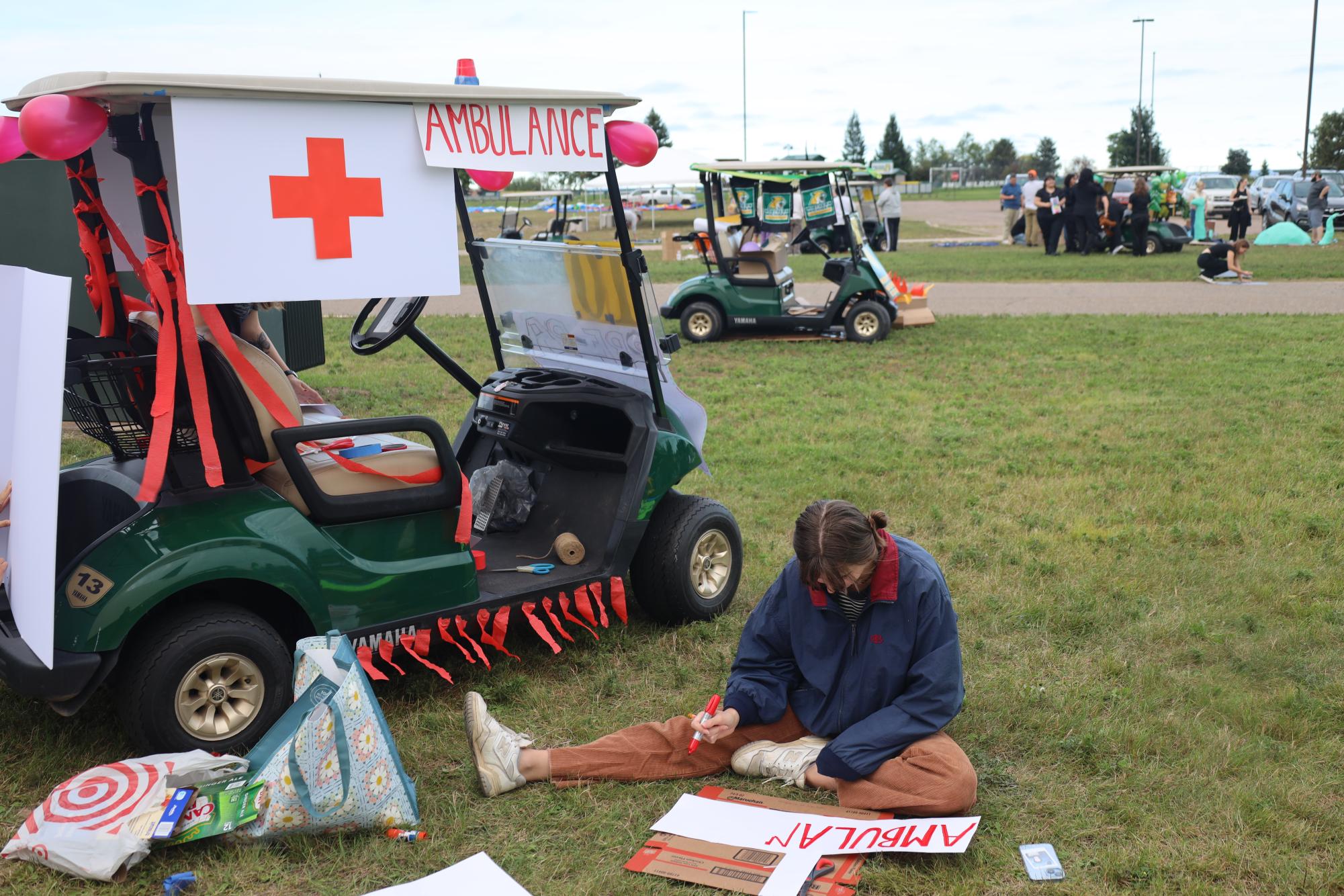 SIRENS! — NMU nursing students were happy to incorporate their future careers into the celebrations with this ambulance-themed golf cart. 