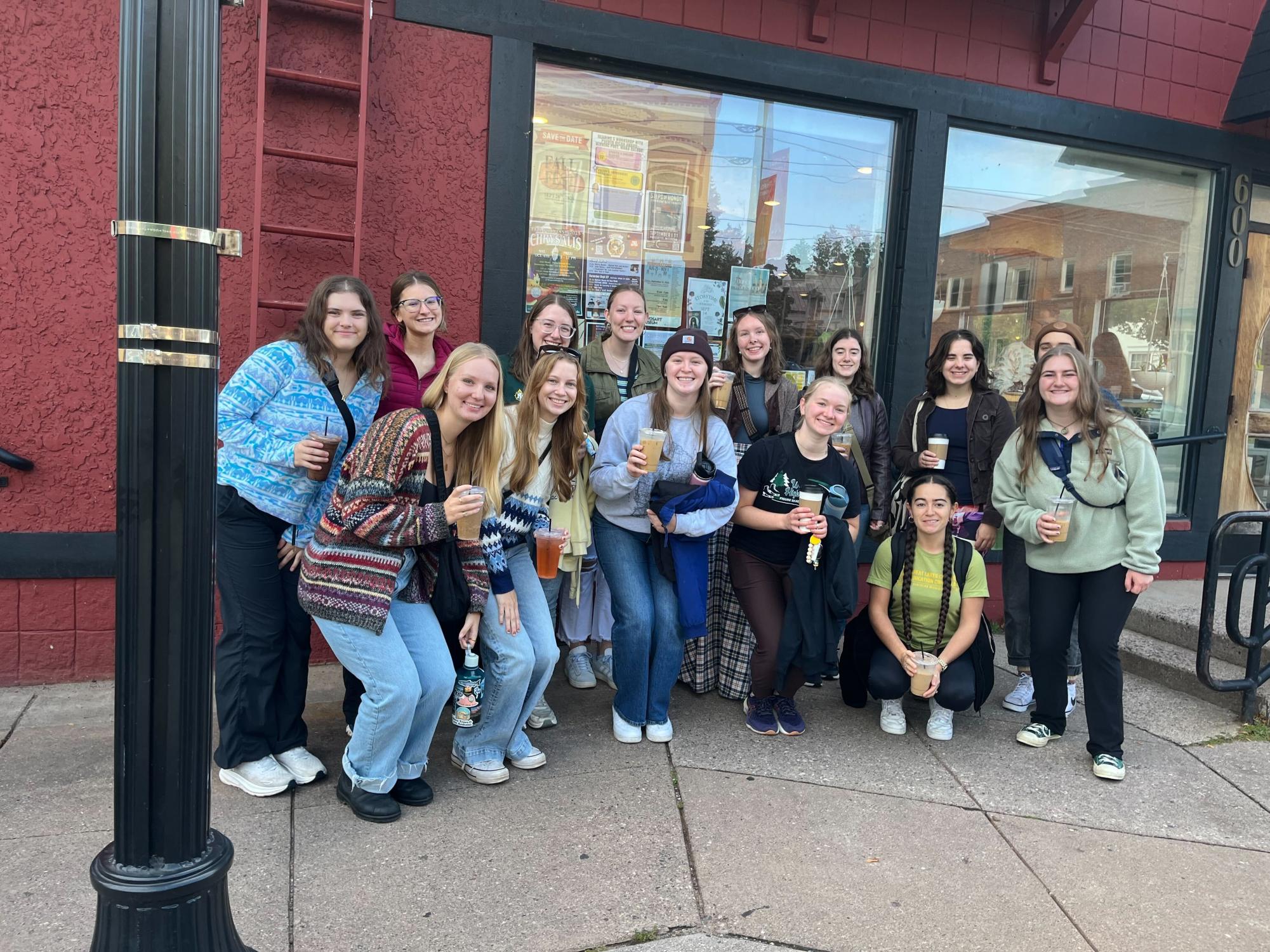 COFFEE AND COMPANY—  Students gather outside of Contrast Coffee Co. with their drinks, surrounded by new and old friends alike.