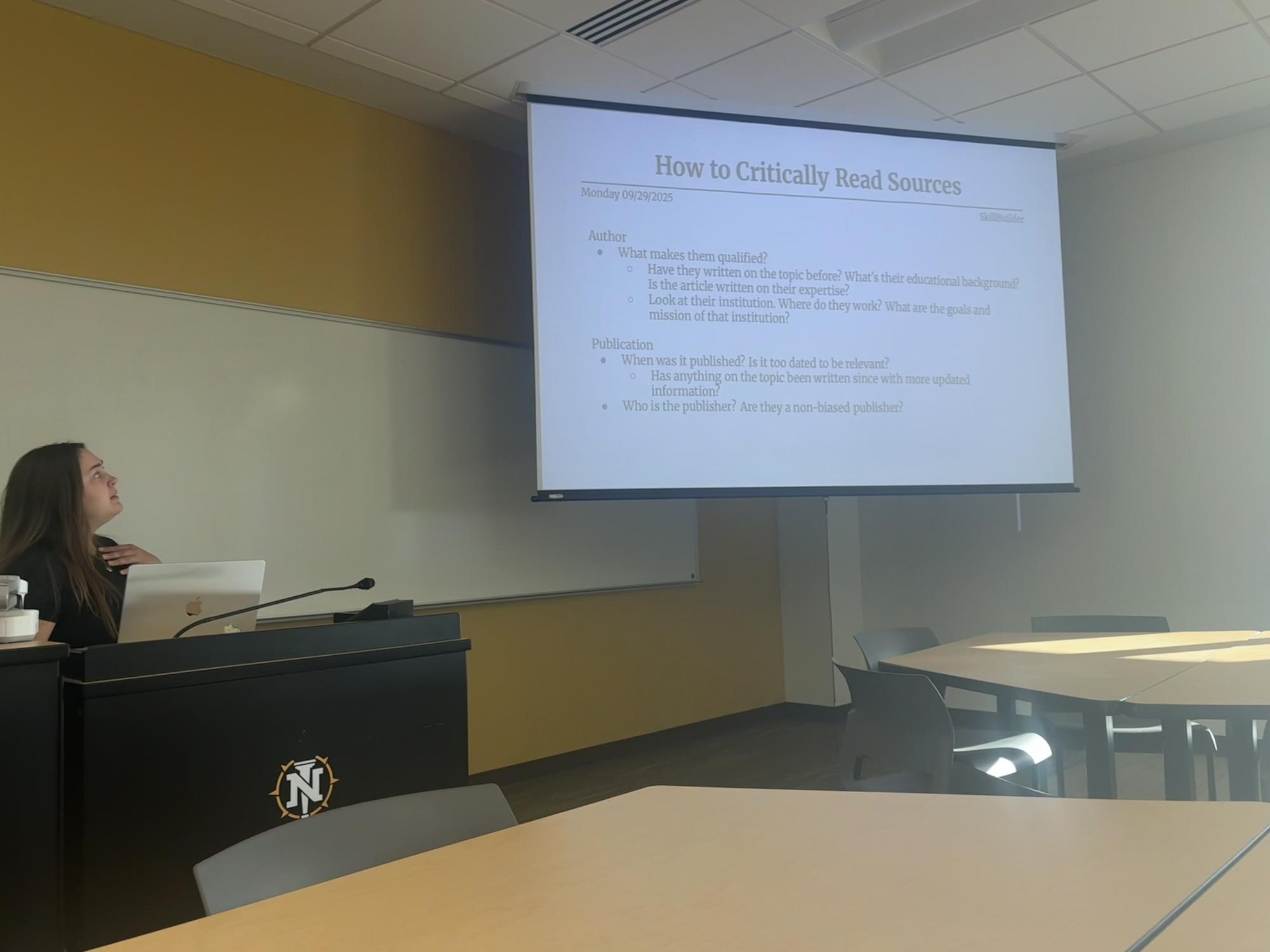 STOP AND READ— Gwen Feamster reads aloud her notes in the Skill Builder workshop. 