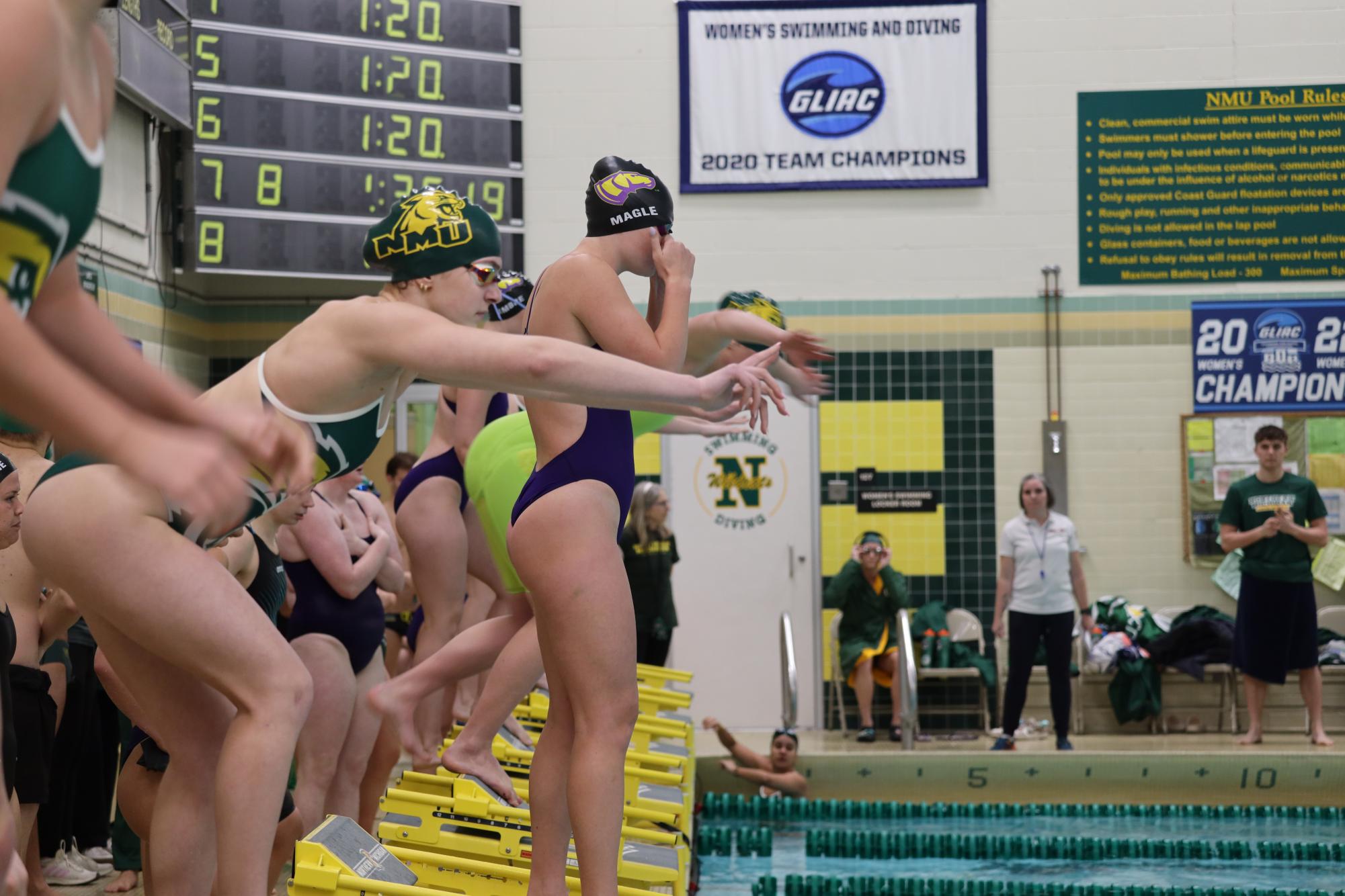 OFF THEY GO—  NMU Swim and Dive takes off at their meet.
 