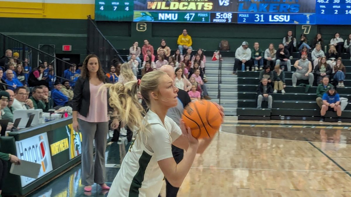 LOADING UP - The Wildcats look to knock down another triple.