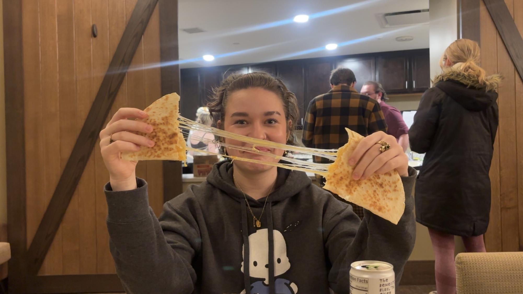 SAY CHEESE—  Nat Whitlock showing off a cheese pull!!!