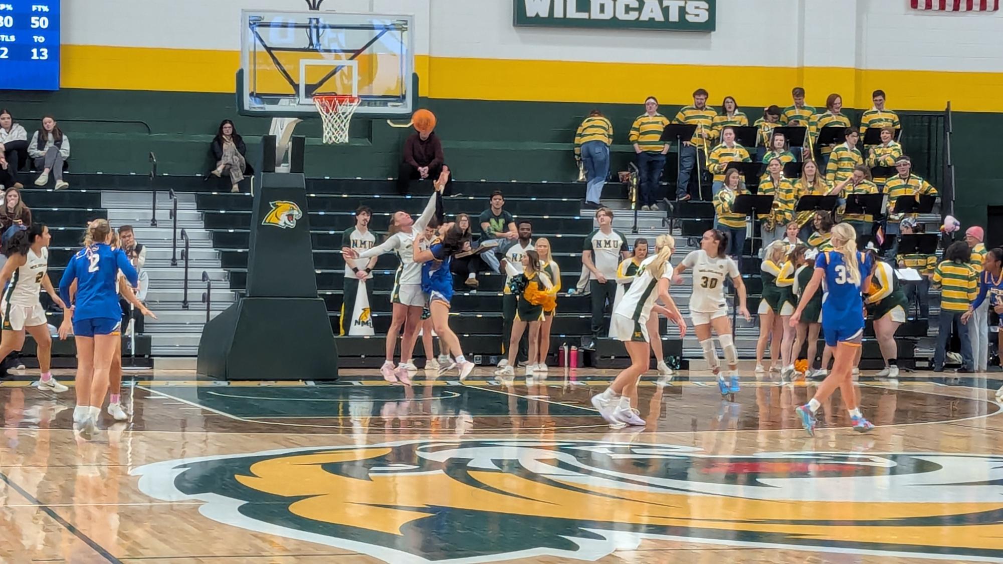 NOTHING EASY - The Wildcats keep the paint on lockdown.