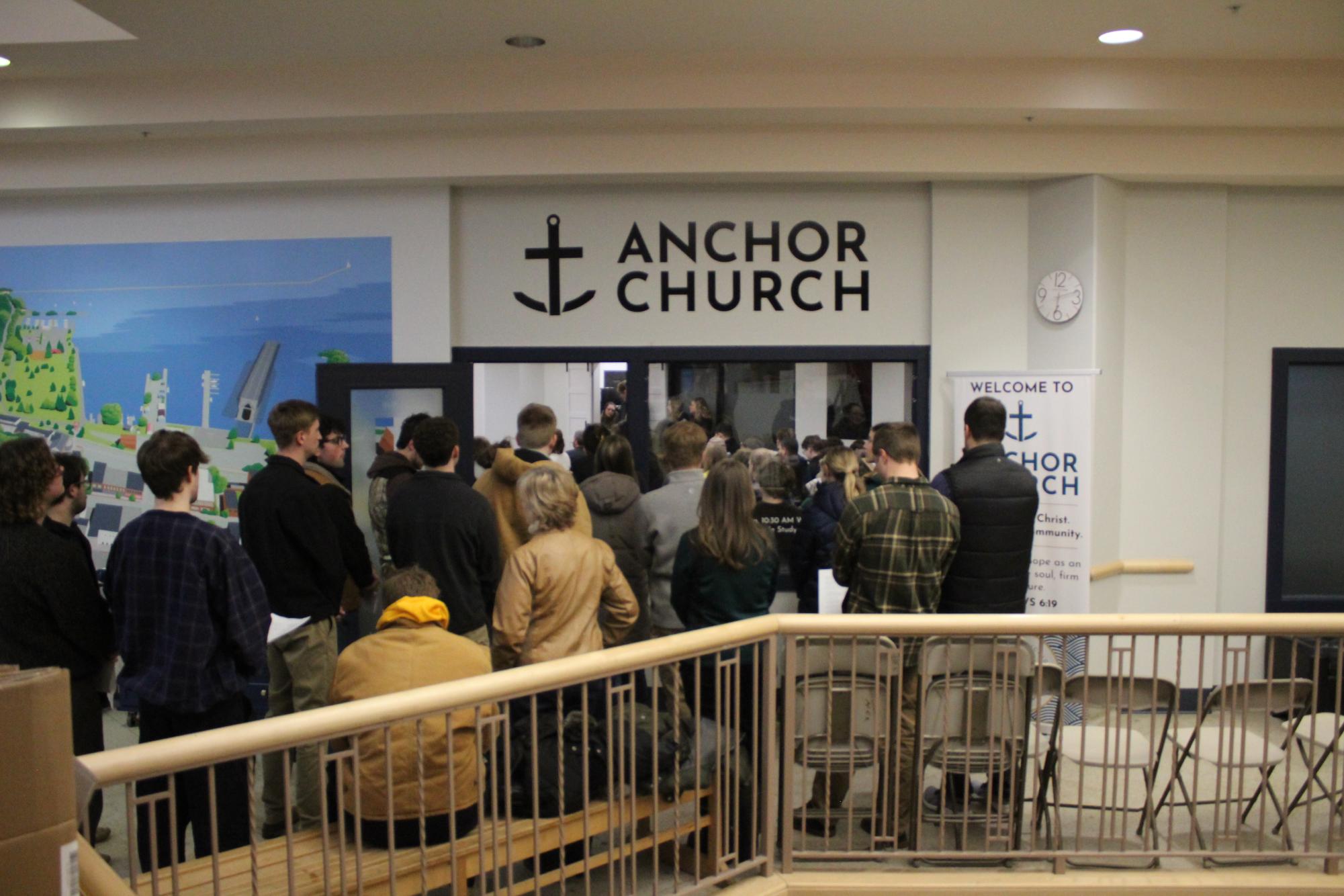 So many attend the memorial for Massey that they flood out of the church and into the main hall of the Masonic Mall in Marquette. 