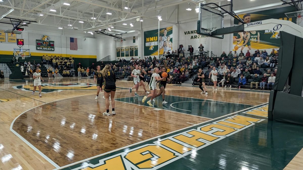 DRIVING—  The Wildcats look to drive towards the basket.