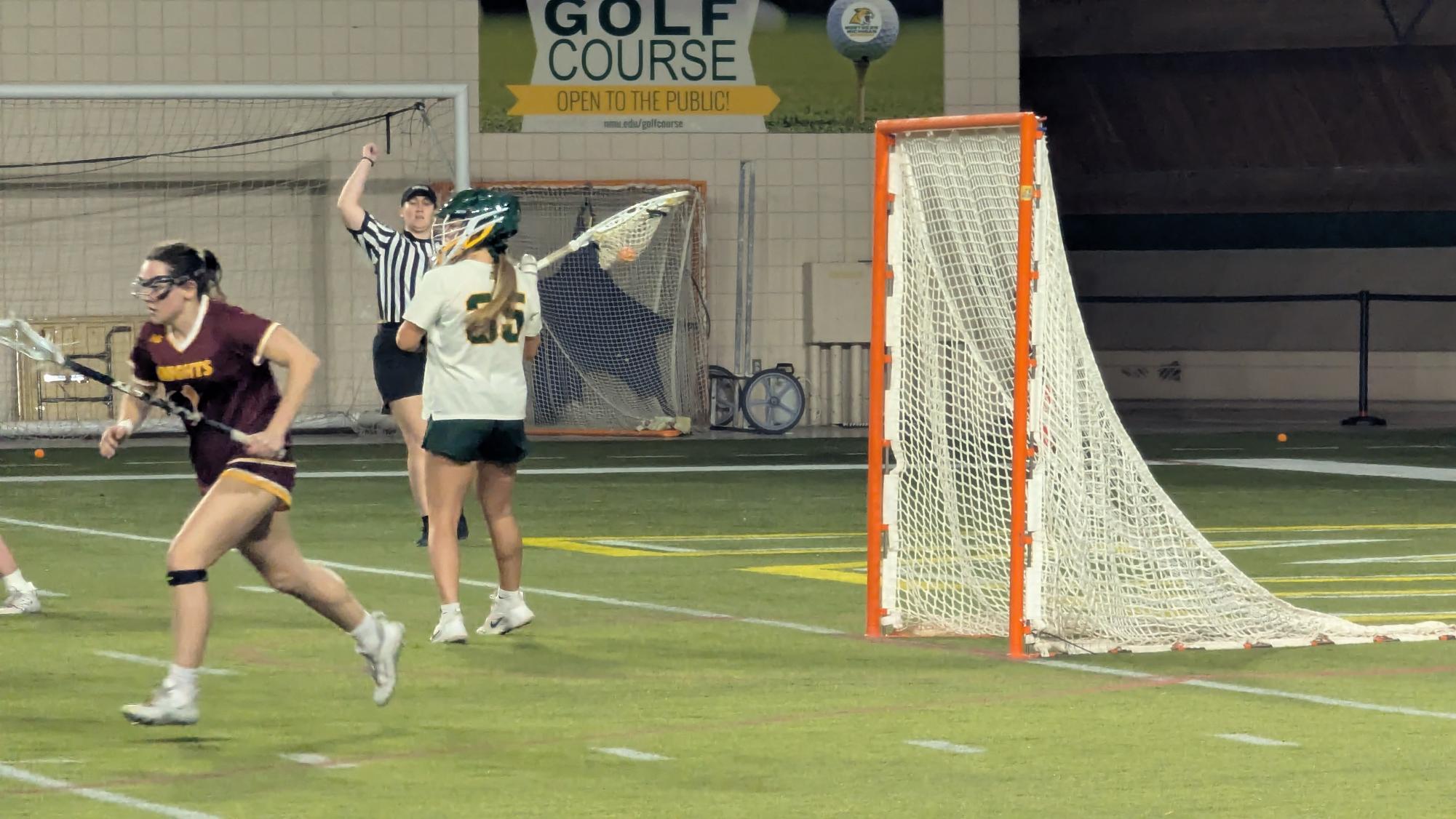 BETWEEN THE PIPES—  Junior netminder Lauren Esposito remains a wall in the goal. 