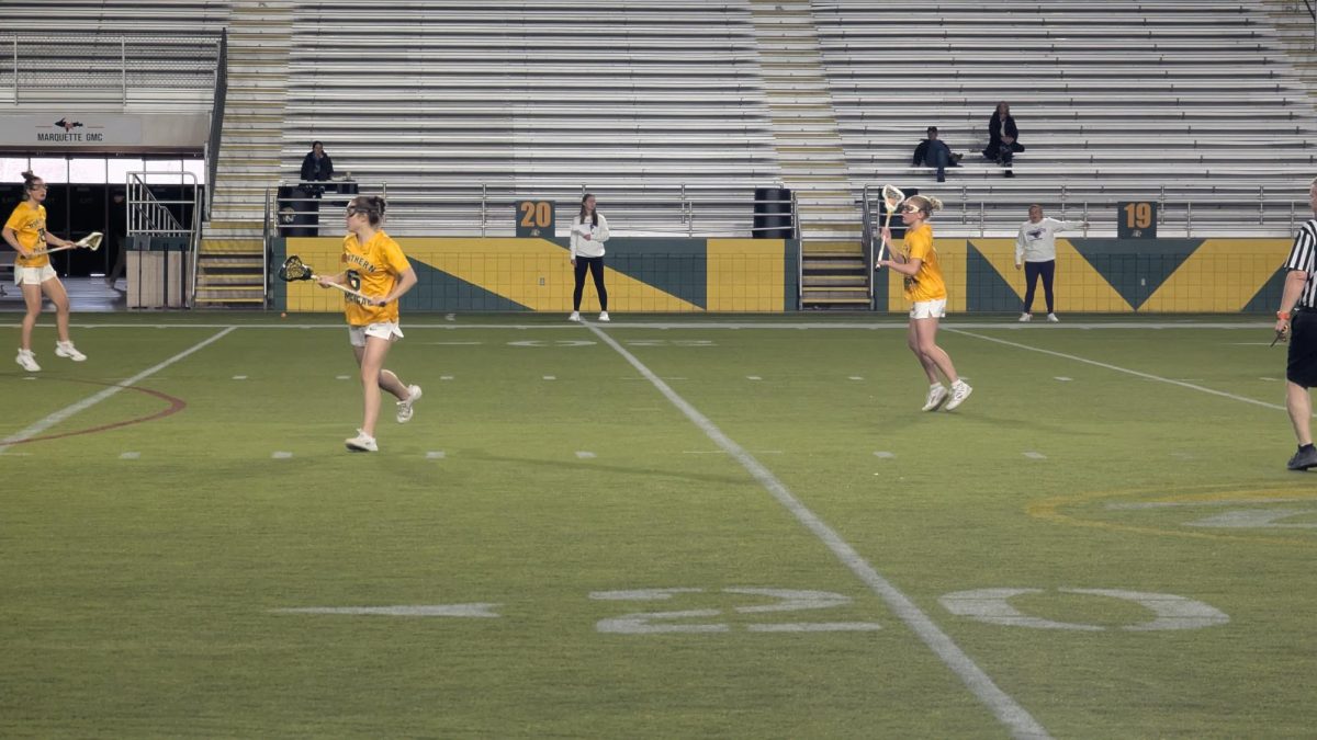 PUSH THE PACE - The Wildcats offense looks to make a play upfield.