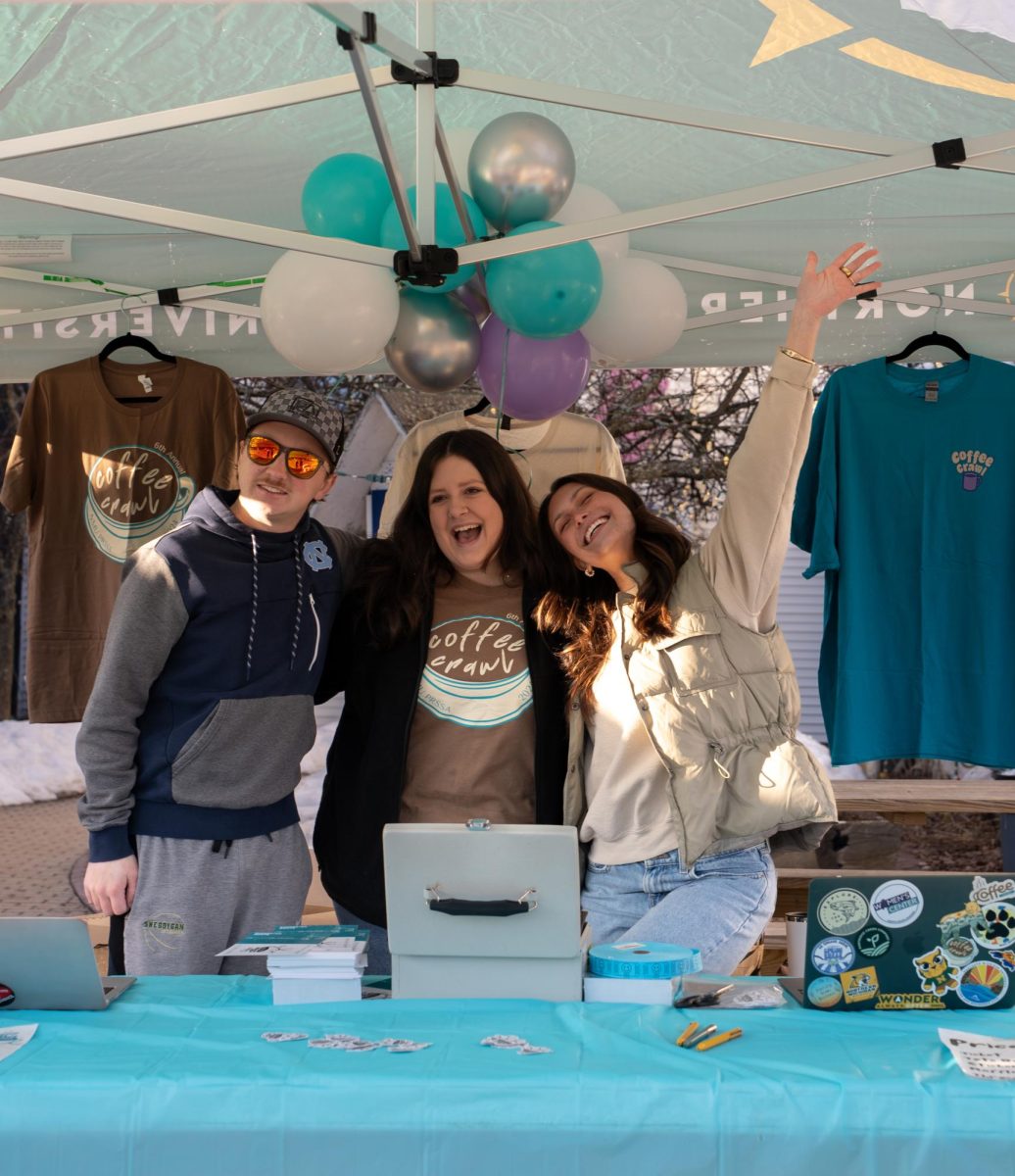 PRSSA members run the ticket booth as students line up to purchase their tickets at the seventh annual coffee crawl.