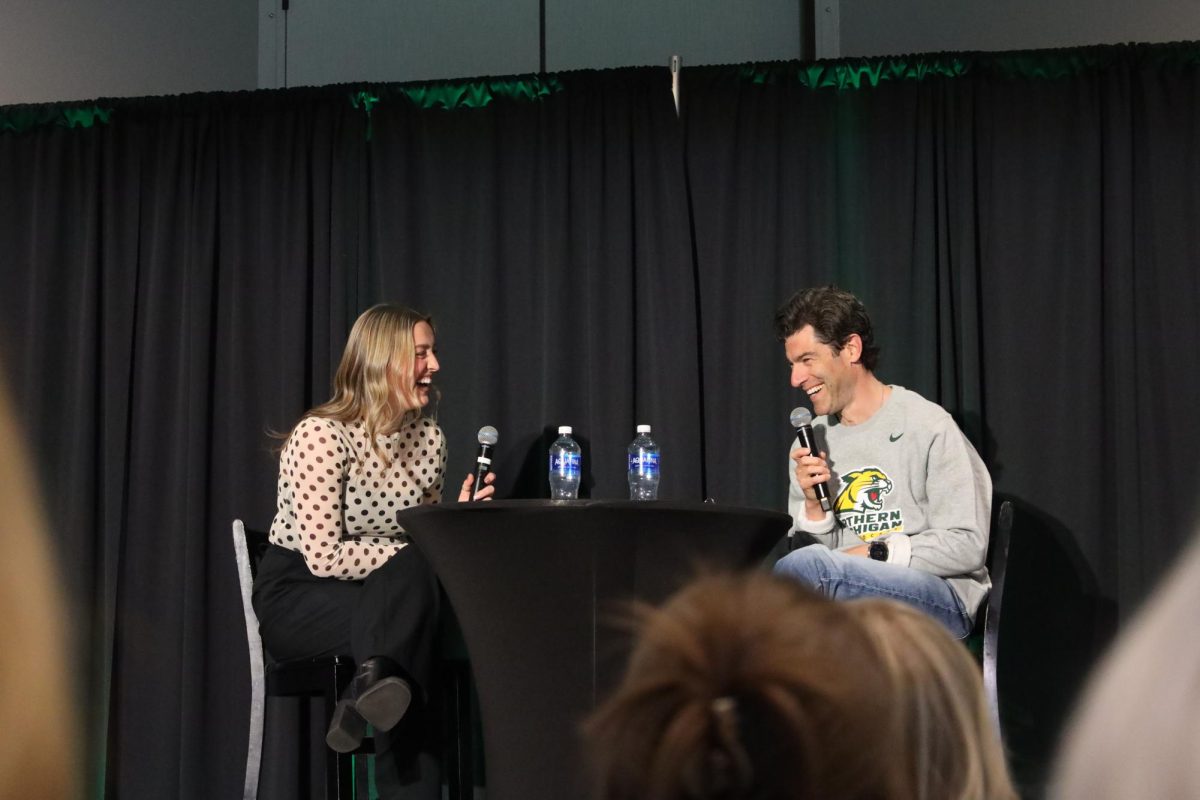 Max Greenfield getting interviewed by the president of Platform Personalities